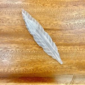 Close-up of the unique Selenite Feather Incense Holder with intricate detail, embodying spiritual serenity.
