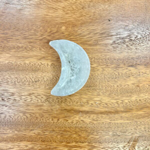 Top-down view of the Selenite Moon Bowl, emphasizing its perfect crescent shape and smooth surface.