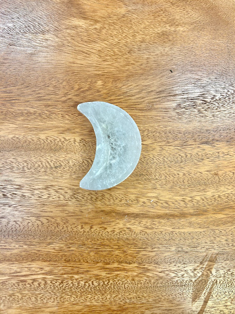 Top-down view of the Selenite Moon Bowl, emphasizing its perfect crescent shape and smooth surface.