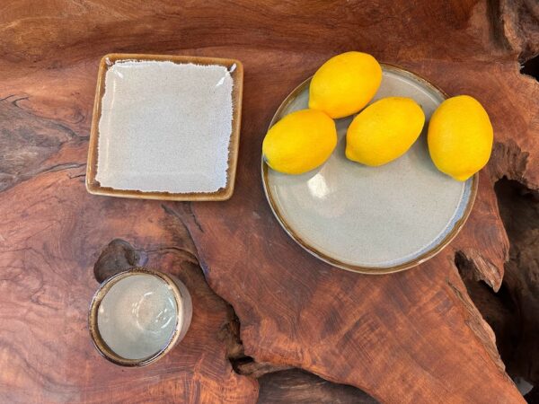Seminyak Chic Set on a wooden background with lemons, capturing a tropical, modern vibe